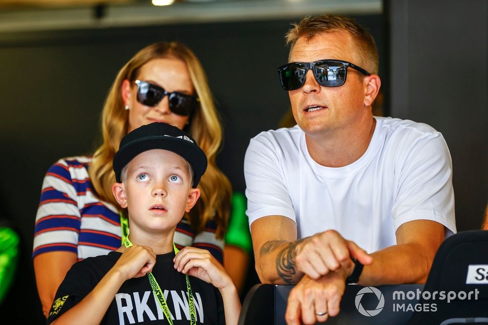 Kimi Raikkonen in the Stake F1 Team Kick Sauber garage with his son, Robin