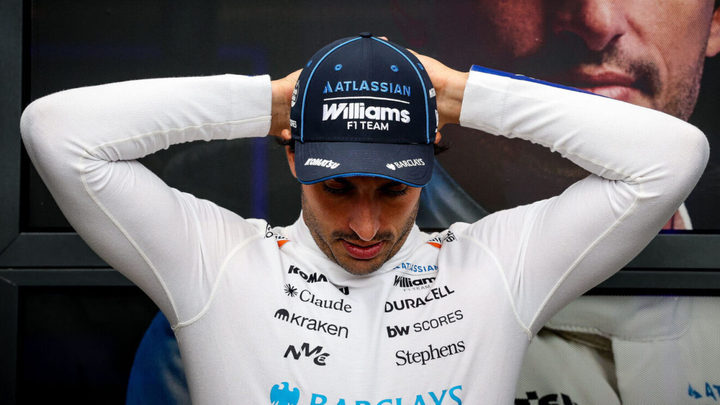 Carlos Sainz with his hands behind his head