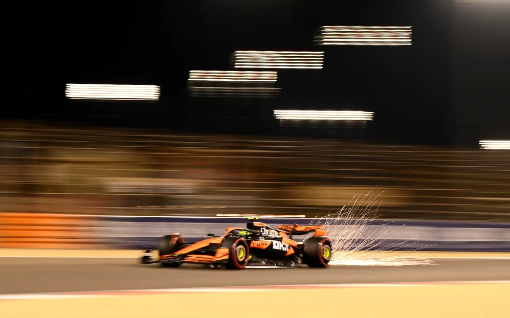BAHRAIN, BAHRAIN - MARCH 01: Sparks fly behind Lando Norris of Great Britain driving the (4)